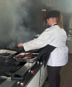 Culinary students learning to serve